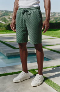 Model is 6'0 with a waist 28", wearing a W32